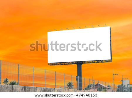 Blank billboard with a background blur of colorful sky. With clipping path on screen - can be used for trade shows, and advertising or promotional poster for you.
