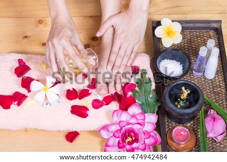 Closeup photo of a female hands and feet at spa salon
