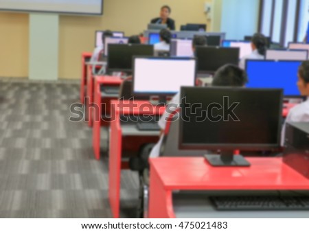 Blur blurred student with teacher learning business technology desktop computer room in teaching lab education