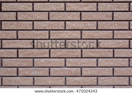 The texture of the stone wall. Stone in the section. Limestone. Granite. Marble. Coquina. Background. Stone floor. Pebbles. Macadam. New clay brick. Red brick. Beautiful masonry.