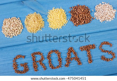 Inscription groats and heap of various groats on blue boards, concept of healthy food and nutrition