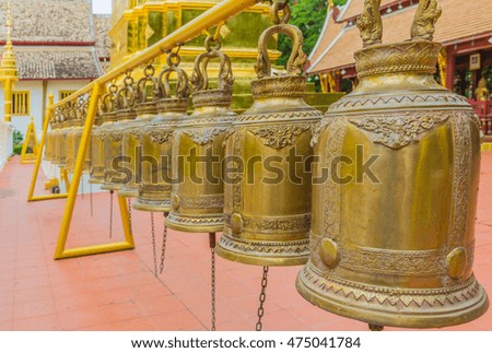 image of golden bell public temple day time.
