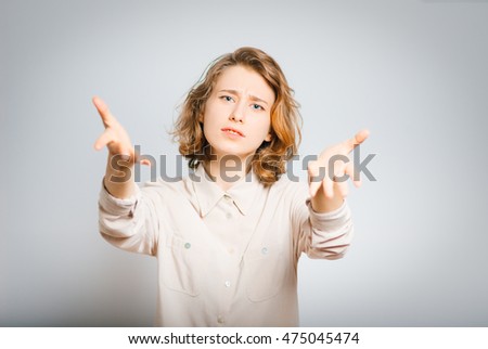 Negative emotion. beautiful girl a quarrel angry, close-up, isolated on a gray background