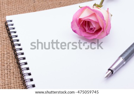 Diary note with rose on gunny bag (Organizer ,agenda, book, diary)