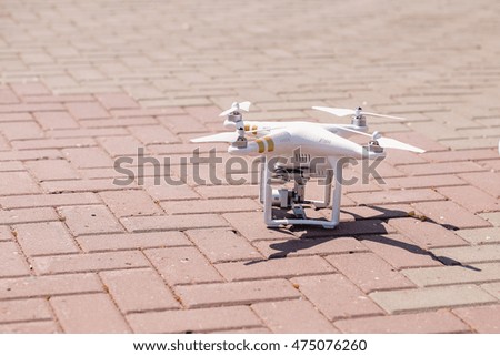 quadcopter one on the ground, ready to fly