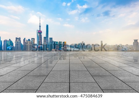 empty tiled floor with city skyline background
