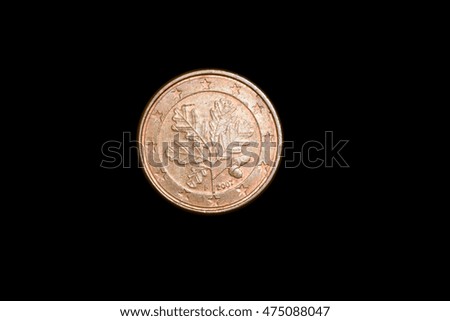 coins lie on a black background close up