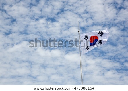 Taegeukgi, Korean flag, the national flag of Korea.
The flag of South Korea, or Taegeukgi has three parts - a white background, a red and blue taegeuk (also known as Taiji and Yinyang) in the center

