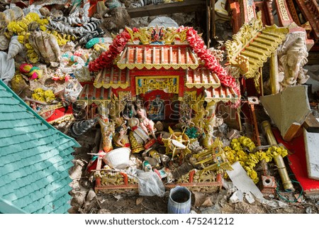 Spirit House Thailand that were damaged were left at the side of the road.