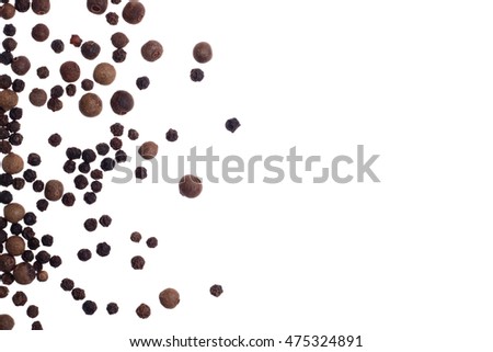 Black pepper and allspice on white background isolated top view Royalty-Free Stock Photo #475324891