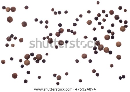 Black pepper and allspice on white background isolated top view Royalty-Free Stock Photo #475324894