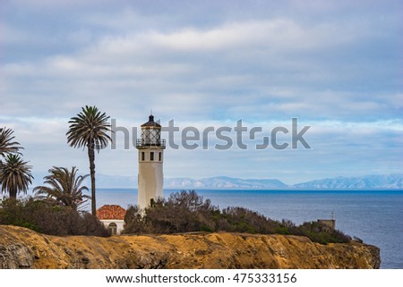 Lighthouse overlooks the California coast and Catalina Island. Royalty-Free Stock Photo #475333156