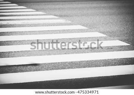 Close up pedestrian crossing on the road, zebra traffic walk way