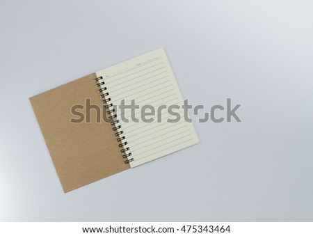 Recycled paper notebook open front cover on white background