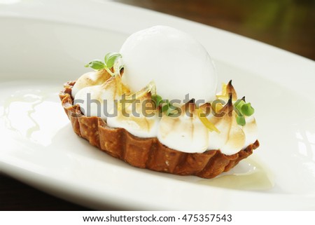 plated mini lemon meringue tart dessert
