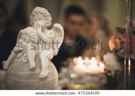 Lovely statue of angels in the wedding restaurant