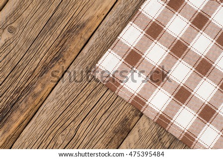 Tablecloth on wooden background,with copy space. Top view.