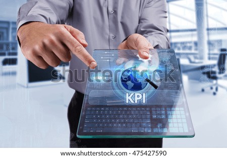 Business, Technology, Internet and network concept. Young business man working on the tablet of the future.