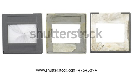 battered grungy 35mm slides, grungy and dirty,one cover slip broken, isolated on white background,free space for your pics