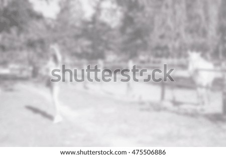 blurred background of people and horse on field outdoor (blur pattern)