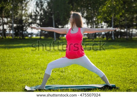 Beautiful pregnant woman in yoga pose