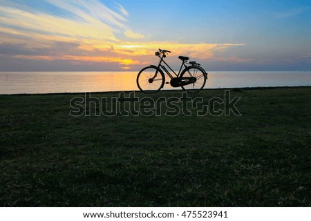 Bicycle witch sunrise on the beach.