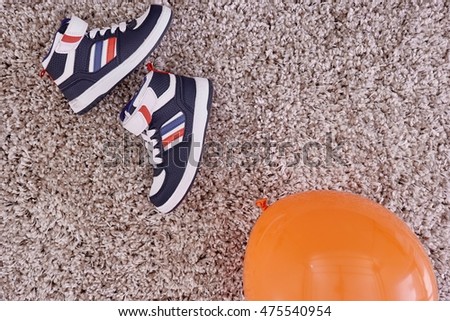 A studio photo of kids shoes                               