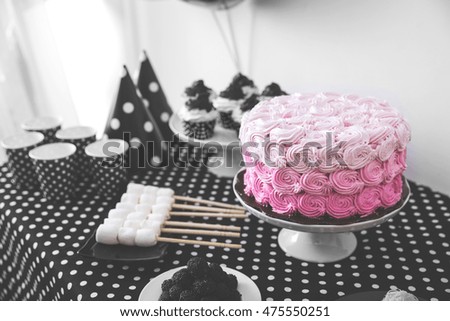 portrait of Black And White Birthday party decoration with full of cake and sweet candy