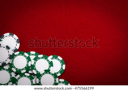 Frame made from casino chips on a red felt with copy space