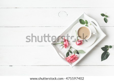Morning. Cup of coffee and rose flowers. Vintage. Flat lay, top view