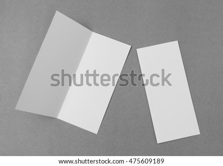 Bifold white template paper on gray  background Royalty-Free Stock Photo #475609189