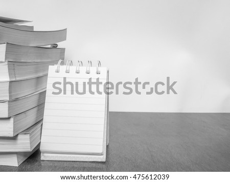 Black & white picture blank notebook on the wooden table, Education concept.