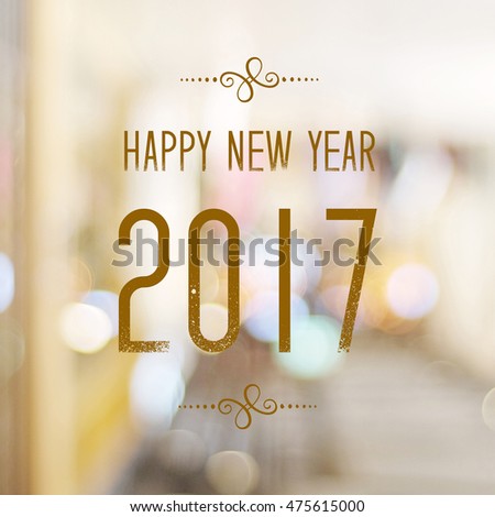 Happy New Year 2017 year on abstract blur festive bokeh background Royalty-Free Stock Photo #475615000
