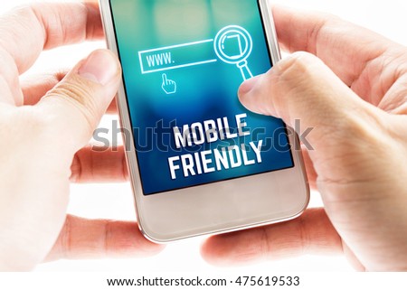 Close up Two hand holding mobile phone with mobile friendly and search icon bar, Digital online Marketing concept. Royalty-Free Stock Photo #475619533