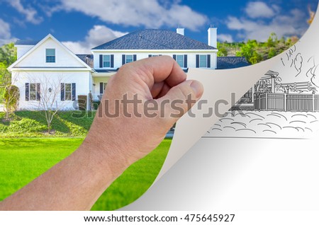Male Hand Turning Page of Custom Home Photograph to Drawing Underneath.