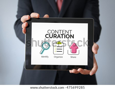 Marketing Concept: Businessman with Content Curation graphic on the screen. All graphics are made up.