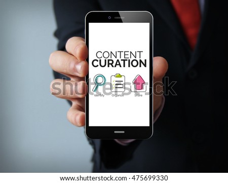 Communication concept: businessman hand holding a touch phone with content curation graphic on the screen
