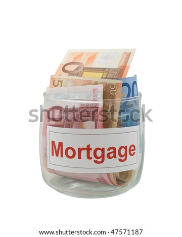 Conceptual photo of a mortgage. Euro banknotes in a glass jar isolated over white.