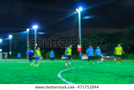 Motion blur of soccer players in a soccer game.