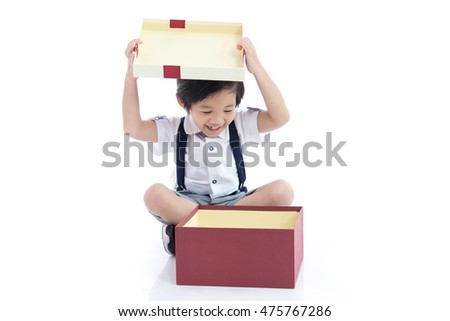 Cute Asian child opening gift present box on white background isolated