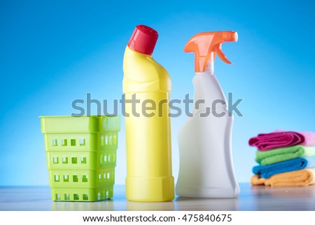 Cleaning concept with supplies, on blue background
