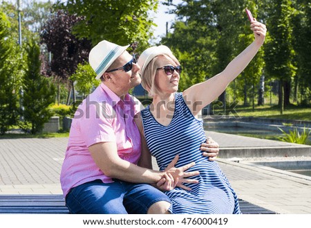 Young Couple Taking Selfie at Park