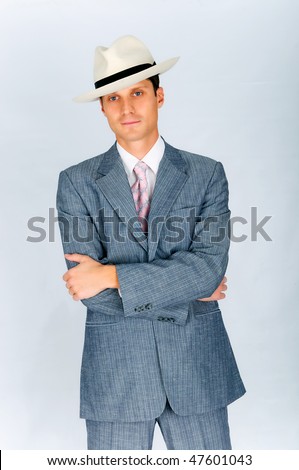 Imposing young man dressed in a suit and hat