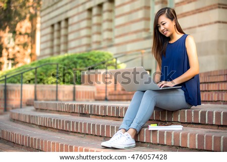 Casual lifestyle candid university campus student studying writing reading typing laptop computer