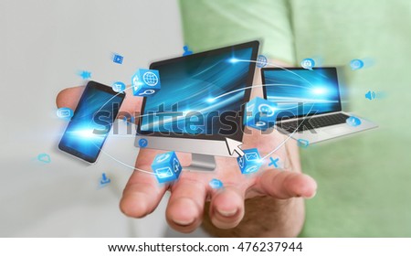 Businessman connected tech devices and icons applications with each other 3D rendering