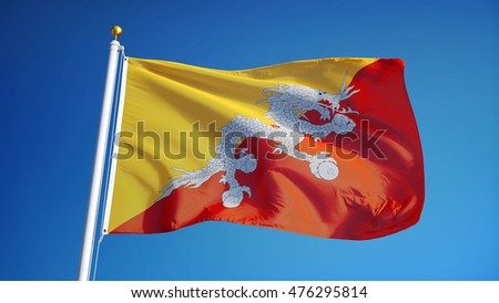 Bhutan flag waving against clean blue sky, close up, isolated with clipping mask alpha channel transparency