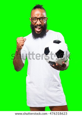 black man holding a soccer ball
