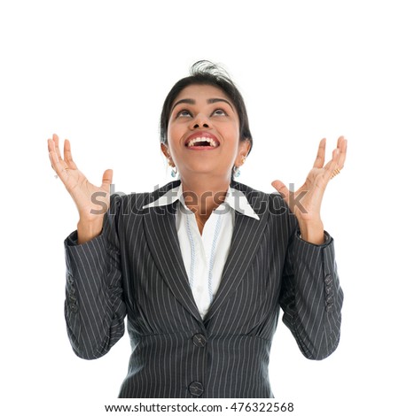 Black woman in formalwear hands open and ready receiving something falling from above, isolated on white background.
