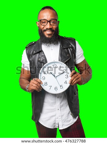 black man holding a clock