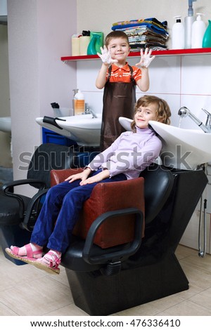 children play in the barbershop